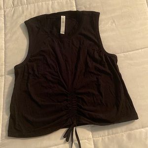 Lululemon black size 6 front cinch cropped sleeveless top. Like new